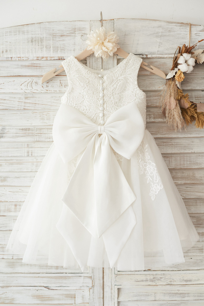 12 Cutest Flower Girl Dresses With Bows You'll Love