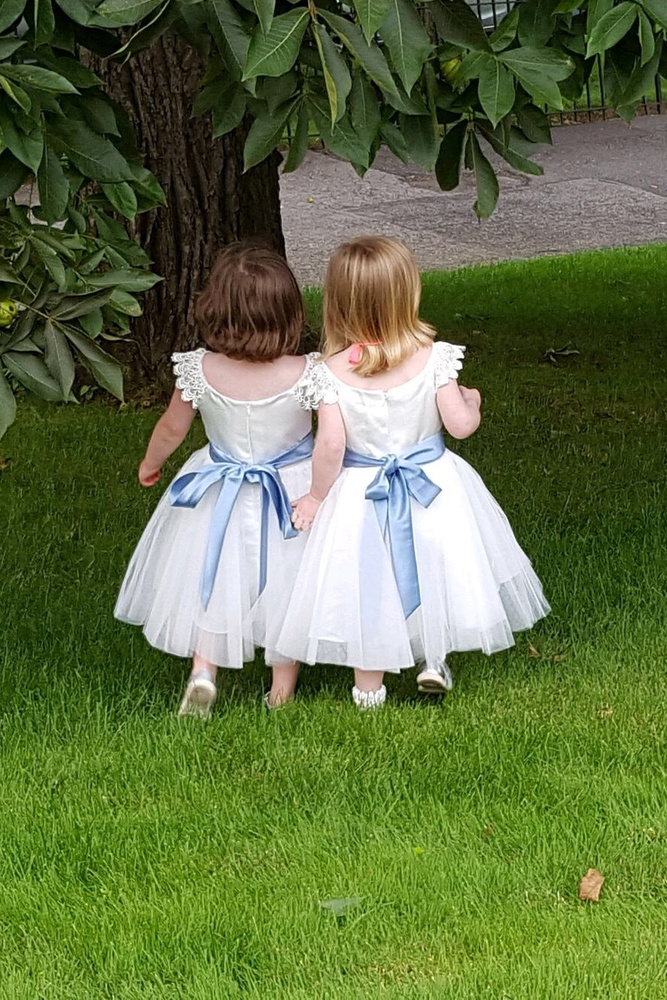 12 Cutest Flower Girl Dresses With Bows You'll Love